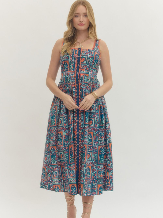 Woman wearing a patterned dress on a white background