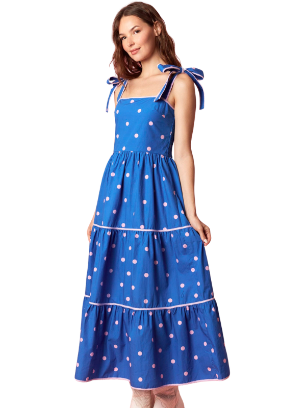woman wearing a blue and pink polka dot dress 
