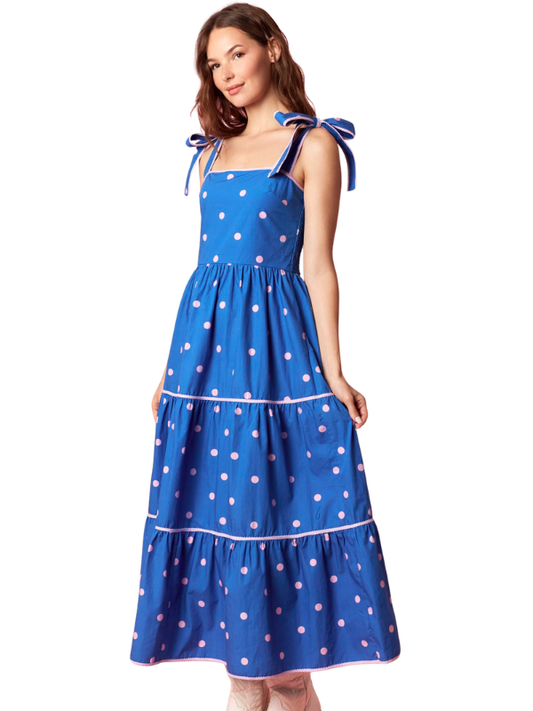 woman wearing a blue and pink polka dot dress 