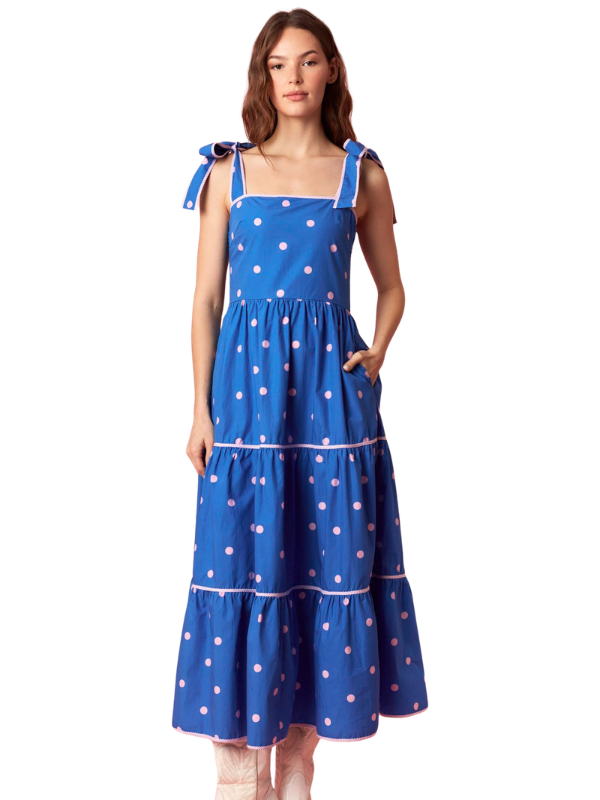 woman wearing a blue and pink polka dot dress 