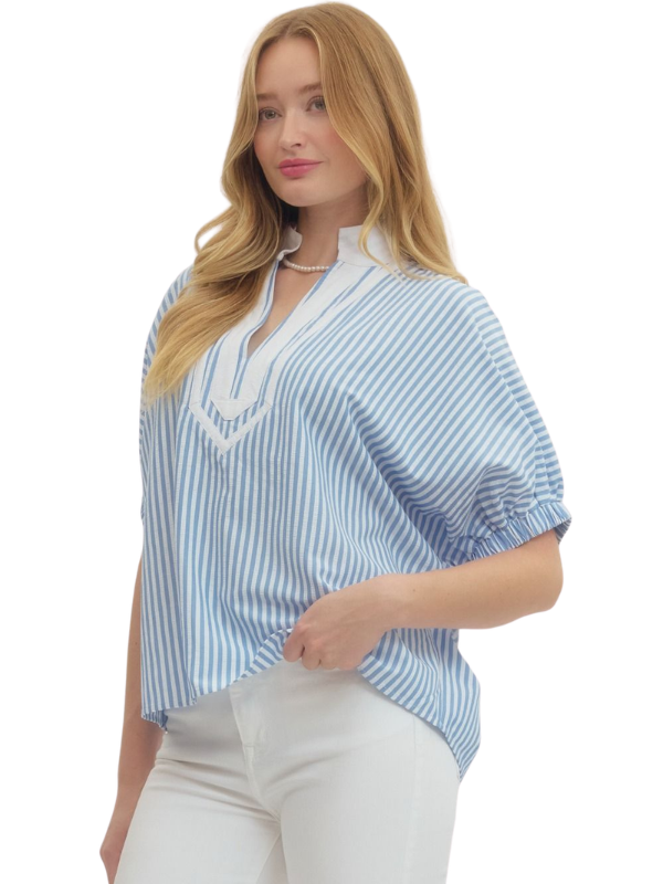 Woman wearing a blue and white striped blouse on a white background