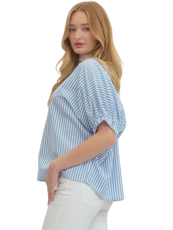 Woman wearing a blue and white striped shirt on a white background