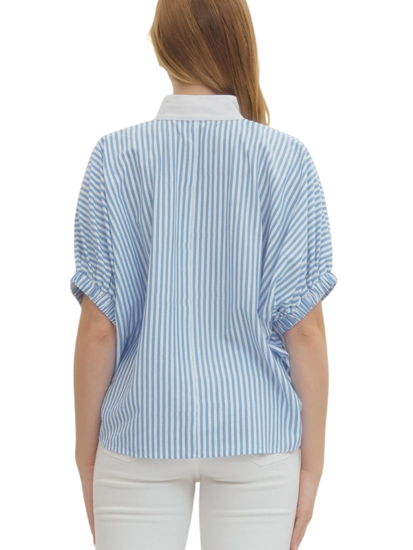 Woman wearing a blue and white striped shirt on a white background