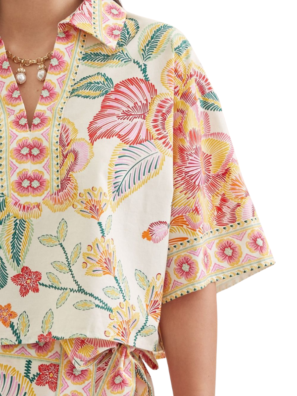 woman wearing a matching botanical top and skort 