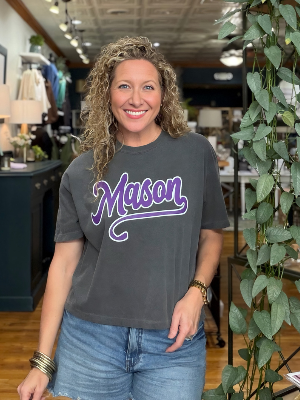 woman wearing a boxy grey tee that says Mason 