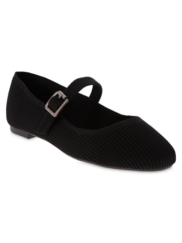 Black ribbed ballet flat shoe with a strap and buckle on a white background