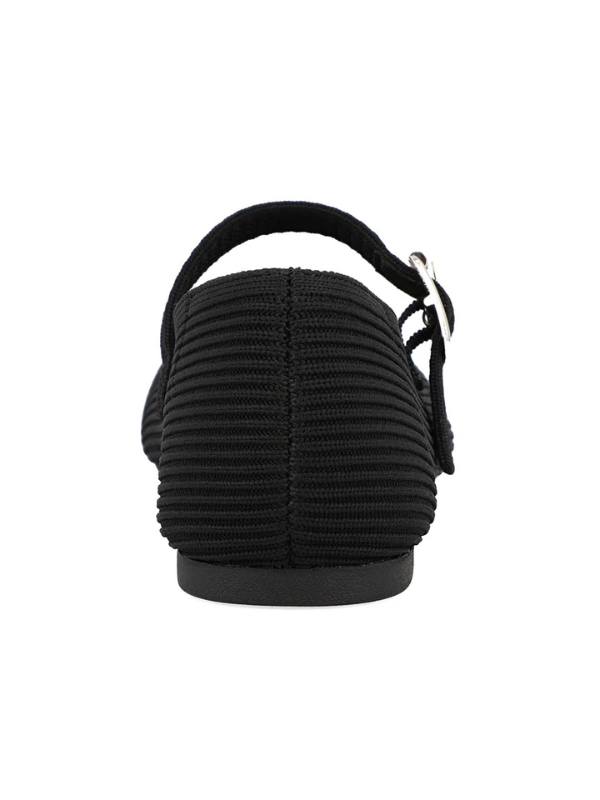 Black sandal with a ribbed texture on a white background