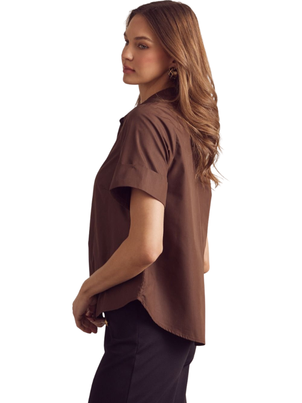 Woman wearing a brown blouse on a white background