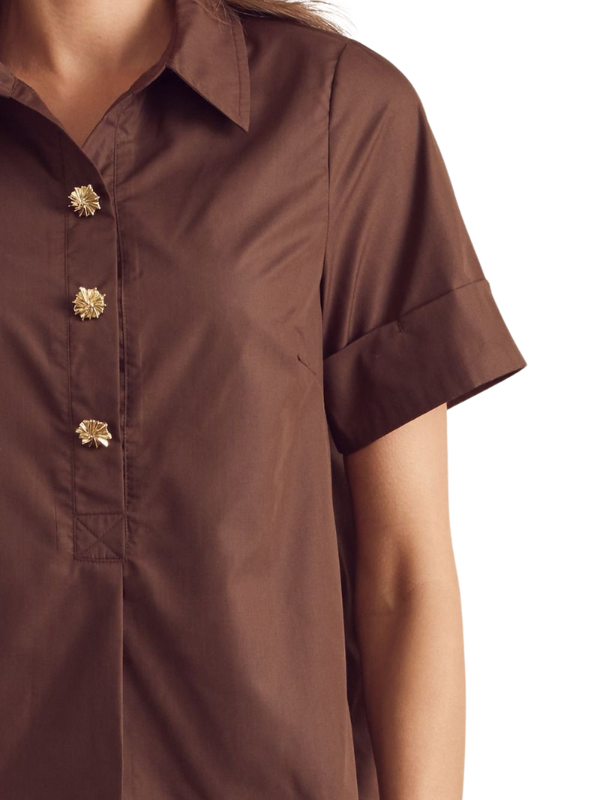 Brown shirt with gold buttons on a white background
