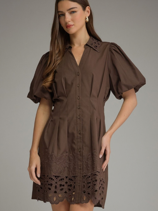 woman wearing a brown eyelet dress 