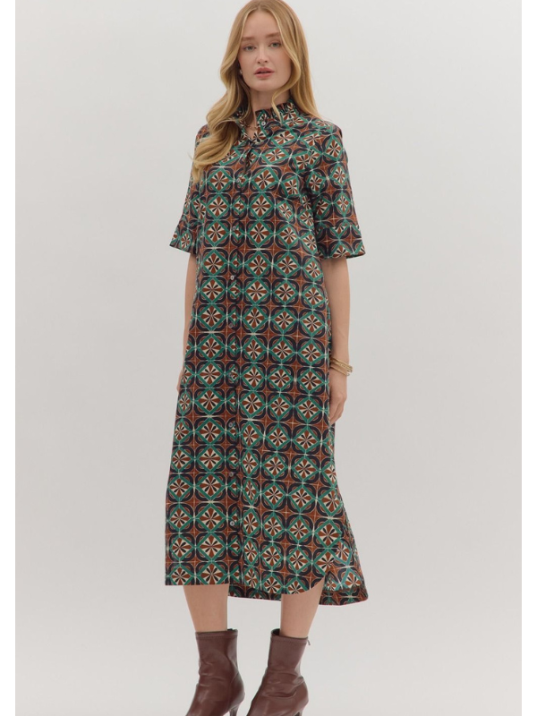 Woman wearing a patterned dress on a white background