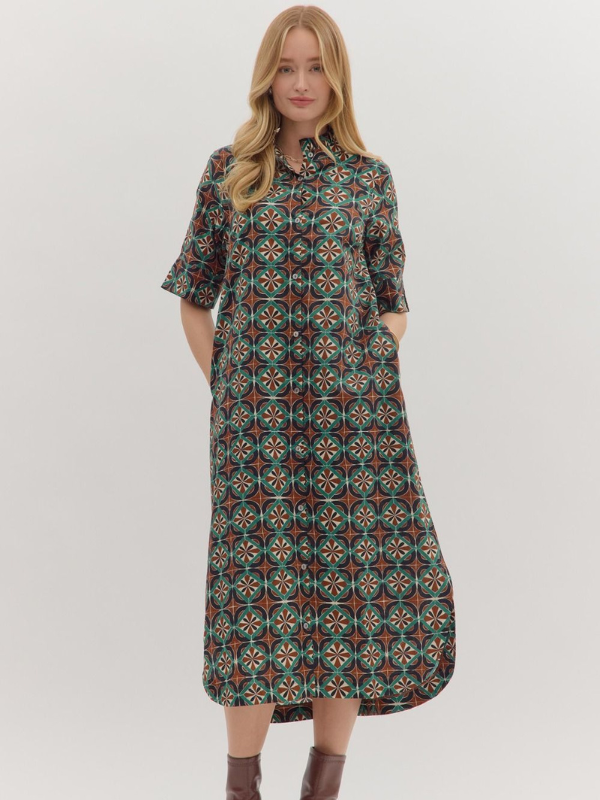 Woman wearing a patterned dress on a white background