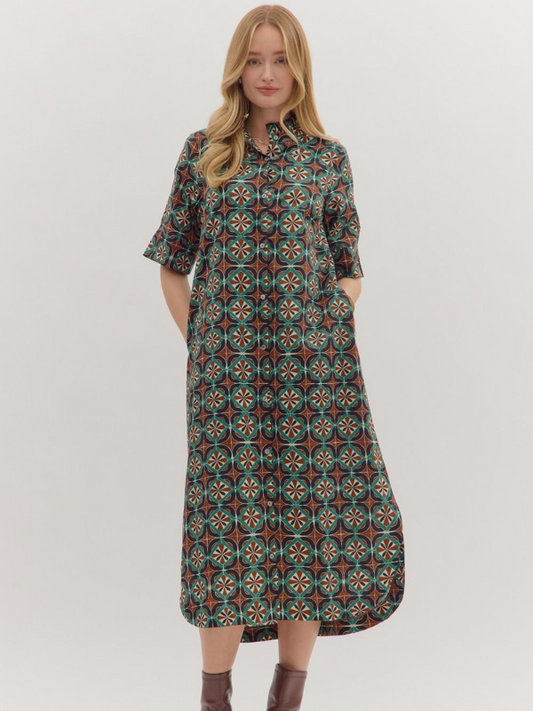 Woman wearing a patterned dress on a white background