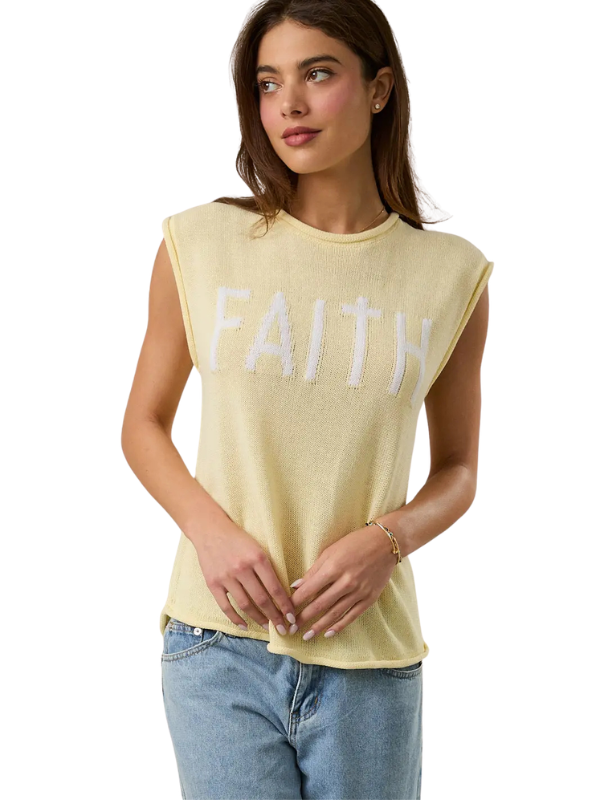 Woman wearing a yellow 'FAITH' t-shirt on a white background