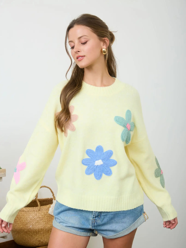 woman wearing yellow sweater with flowers