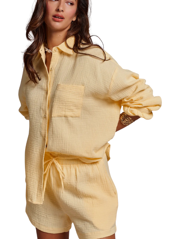 woman wearing butter yellow gauze shorts and matching top 