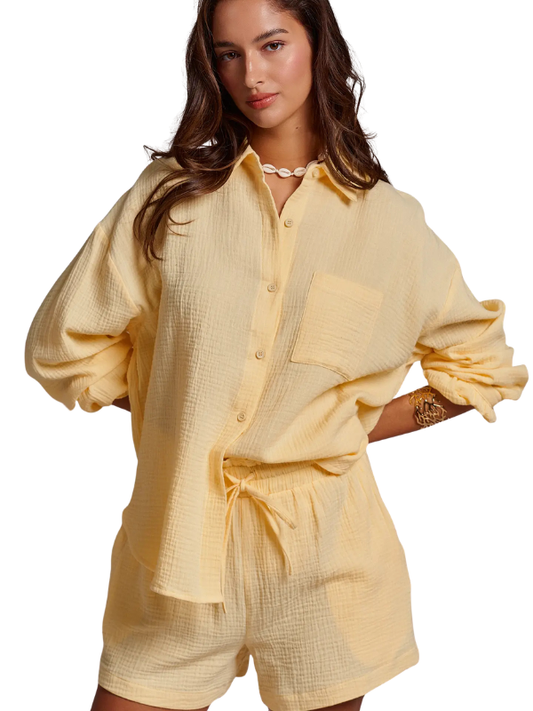 woman wearing butter yellow gauze shorts and matching top 