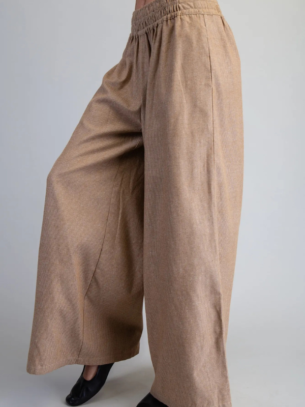 Brown wide-leg pants on a plain background