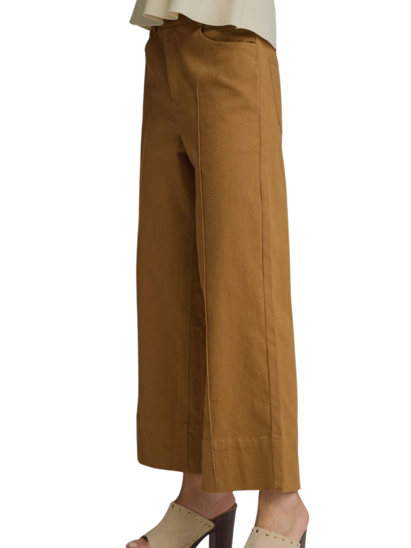 Brown wide-leg pants worn by a person on a white background