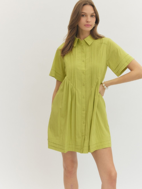 Woman wearing a green dress against a white background