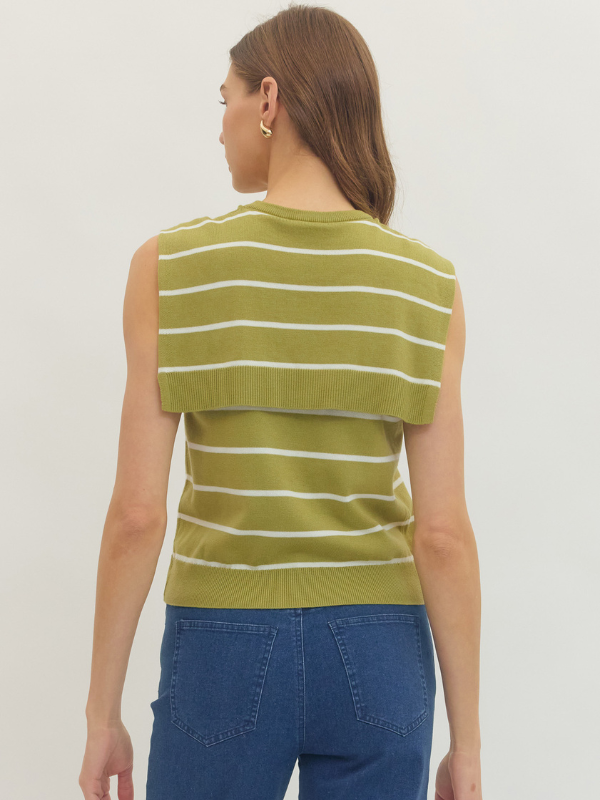 Woman wearing a green and white striped sleeveless top against a plain background