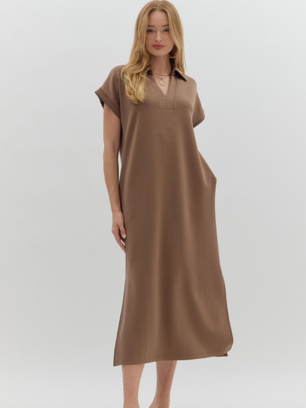 Woman wearing a brown dress on a white background