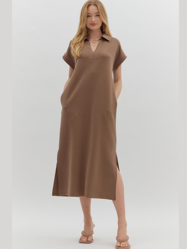 Woman wearing a brown dress on a white background