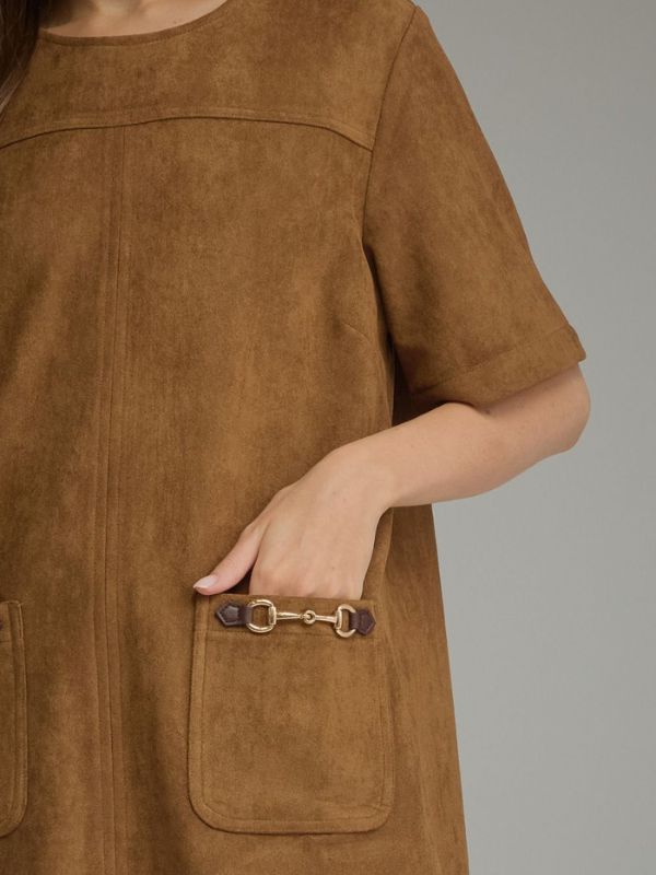 woman wearing a cognac suede type dress