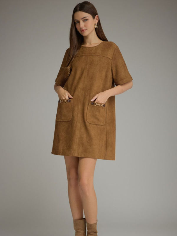 woman wearing a cognac suede type dress
