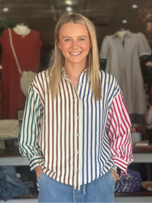 Woman wearing a striped shirt in a clothing store