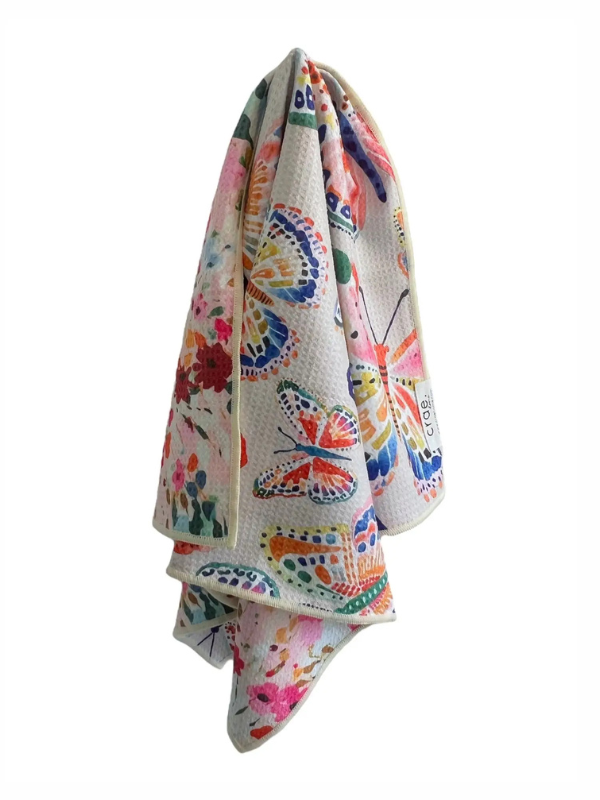 Colorful butterfly-patterned towel on a white background