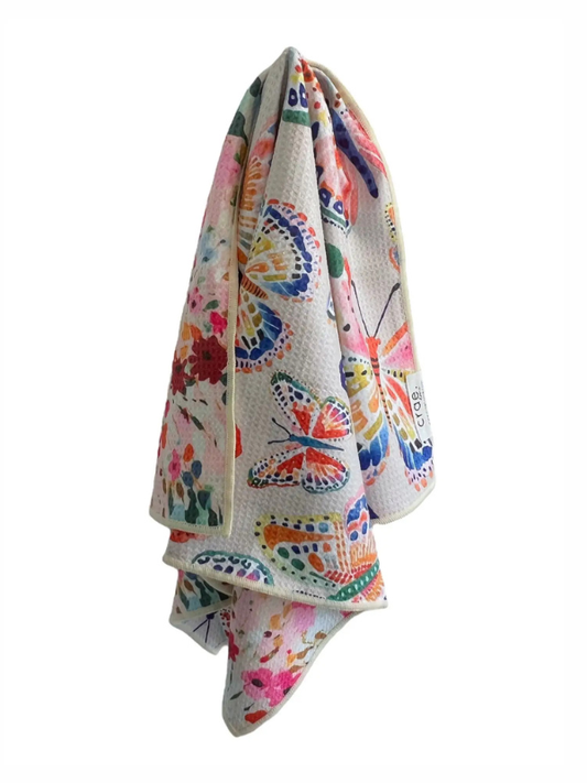 Colorful butterfly-patterned towel on a white background