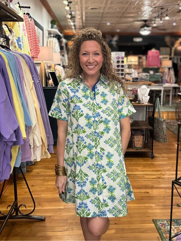 Woman wearing a floral dress in a clothing store
