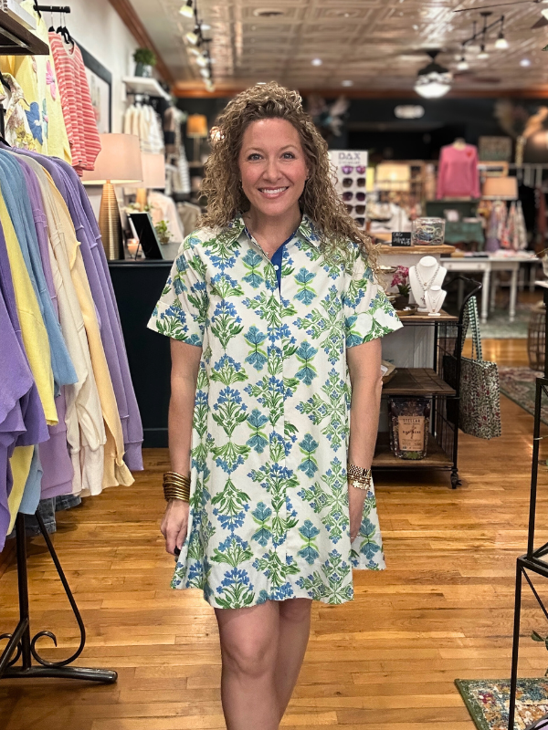 Woman wearing a floral dress in a clothing store