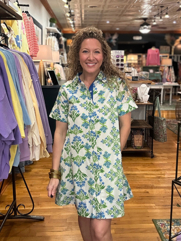 Woman wearing a floral dress in a clothing store