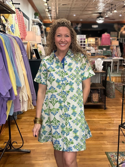 Woman wearing a floral dress in a clothing store