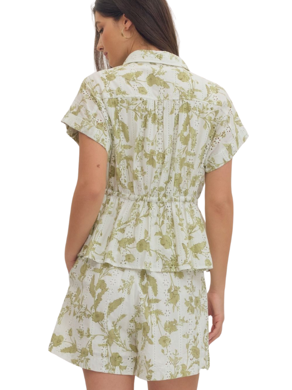 woman wearing a cream and olive collared shirt 