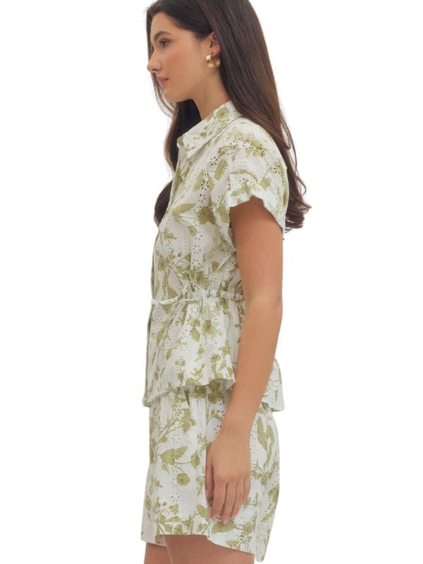 woman wearing a cream and olive collared shirt 