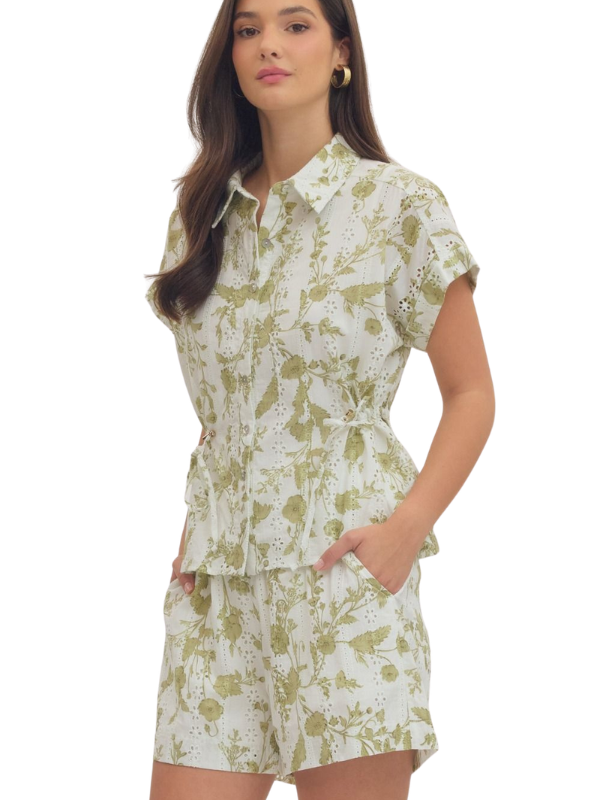 woman wearing a cream and olive collared shirt 