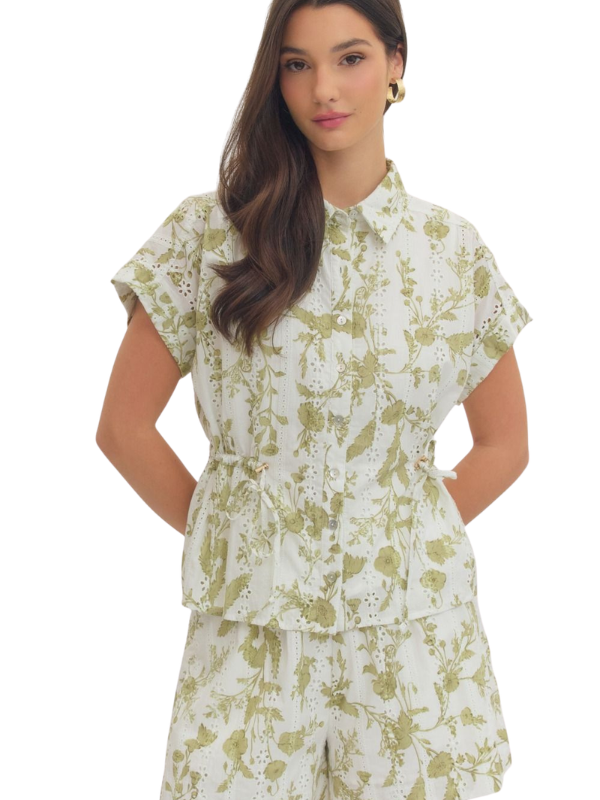 woman wearing a cream and olive collared shirt 