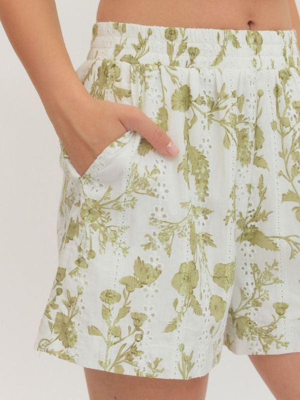 woman wearing olive and cream eyelet shorts