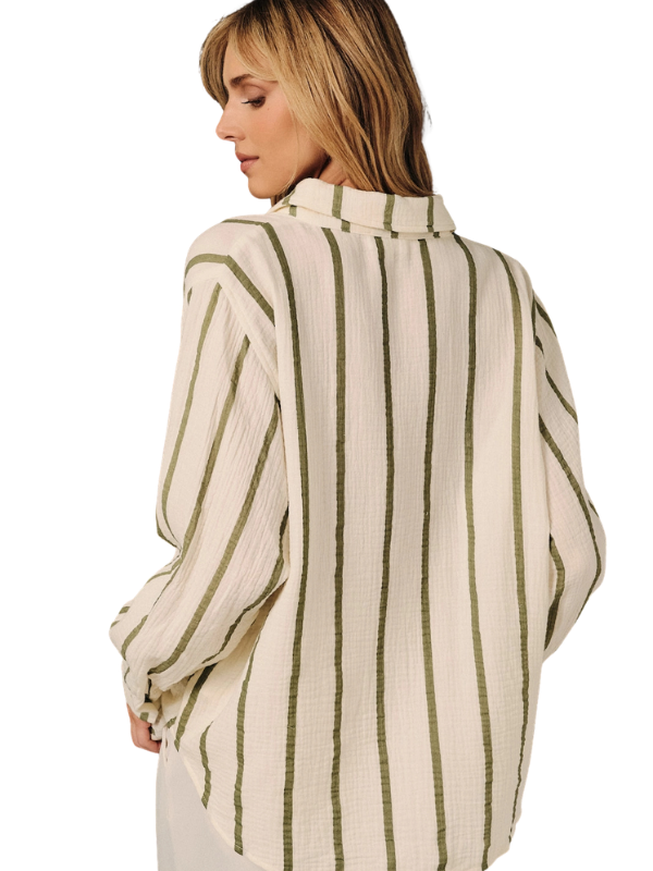 A woman shown from the back wearing a cream-colored crinkle gauze button-up shirt with vertical olive green stripes, set against a plain white background.