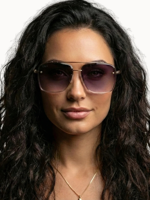 Woman wearing sunglasses with a neutral background
