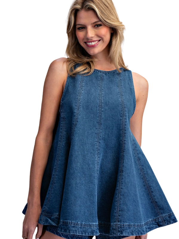 Woman wearing a blue denim dress on a white background