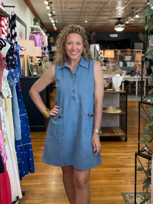 Woman wearing a blue dress in a store setting