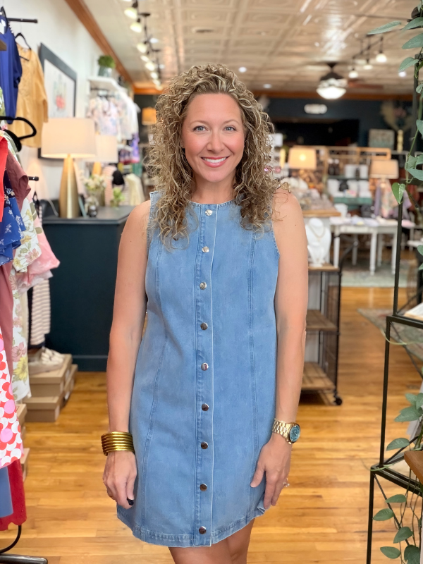 Woman wearing a blue dress in a store setting