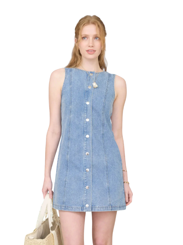 Woman wearing a denim dress on a white background