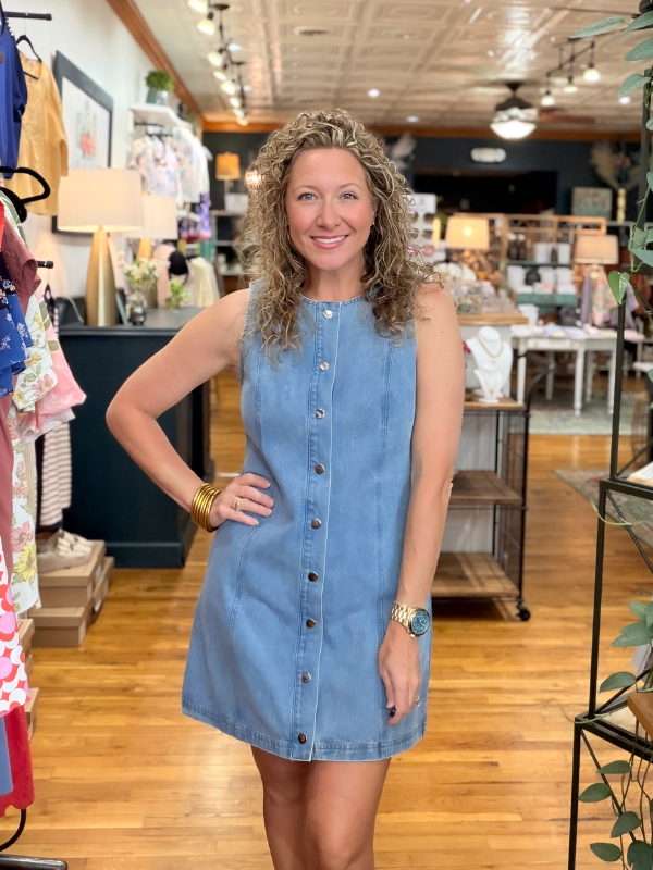 Woman wearing a blue dress in a store setting