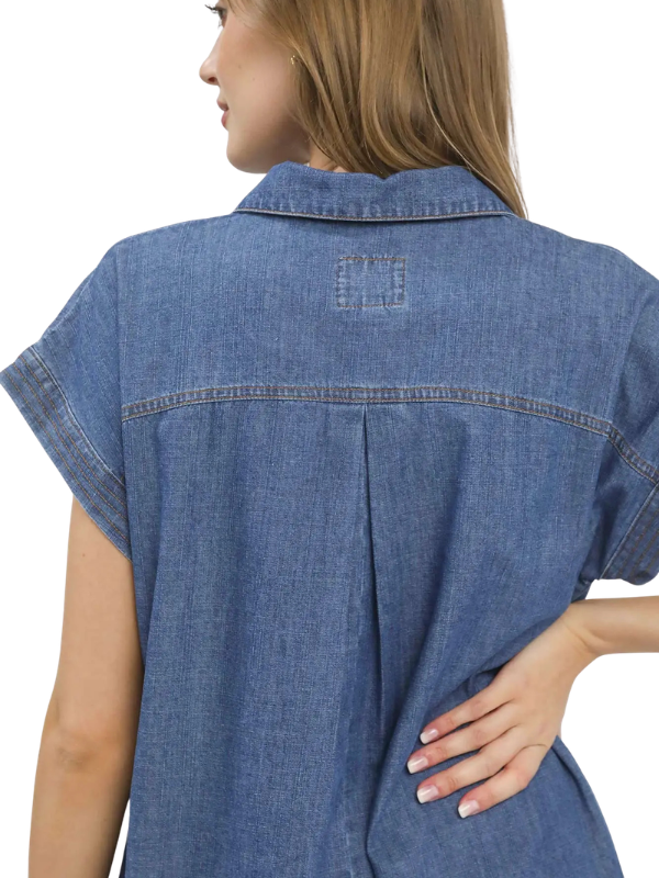 A woman wearing a blue denim short-sleeve shirt dress, shown from the back against a plain white background.