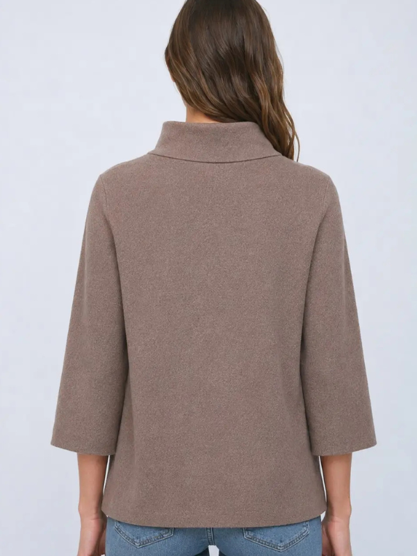 woman wearing a dusty brown sweater with jeans 